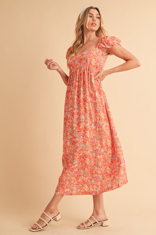 Vestido midi con escote cuadrado, mangas abullonadas y estampado floral con espalda recortada de Aemi + Co